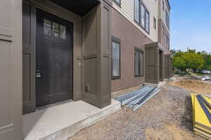 Property entrance with brick siding