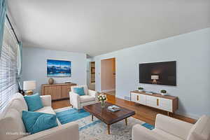 Living area featuring wood finished floors and baseboards