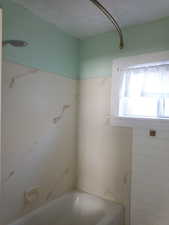 Bathroom featuring tub / shower combination