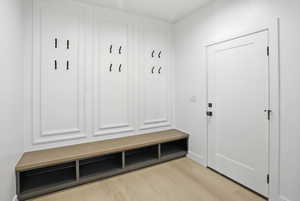 Mudroom with light wood-style floors