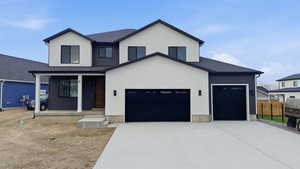 View of front of house featuring driveway, stucco siding, a porch, and a shingled roof