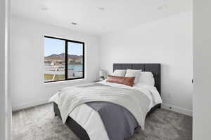 Carpeted bedroom with baseboards