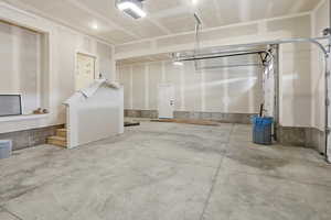 Garage featuring a garage door opener