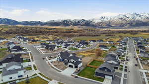 Aerial view of residential area featuring a mountainous background