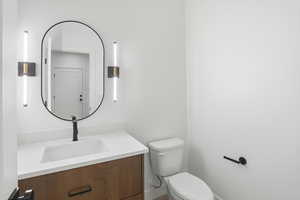 Bathroom featuring vanity and toilet