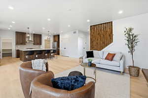 Living area featuring recessed lighting and light wood-type flooring