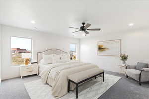 Bedroom featuring light colored carpet, ceiling fan, and recessed lighting