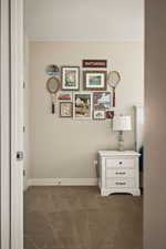 Carpeted bedroom with baseboards