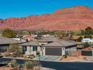 View of mountain backdrop featuring nearby suburban area
