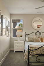 Bedroom featuring dark colored carpet and recessed lighting