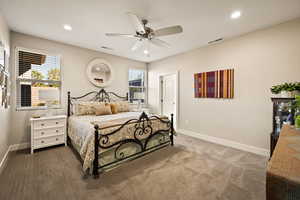 Bedroom featuring multiple windows, recessed lighting, carpet flooring, and a ceiling fan