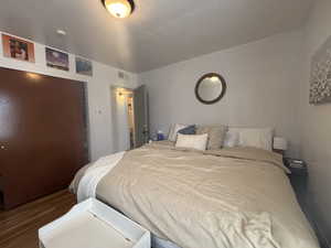 Bedroom featuring a closet and wood finished floors