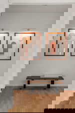 Hallway with wood finished floors and baseboards