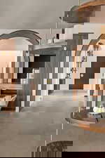 Corridor featuring arched walkways