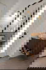 Bathroom featuring vanity and baseboards