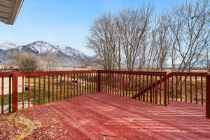 Wooden terrace featuring a mountain view