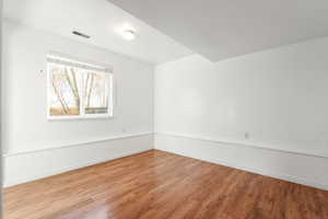Unfurnished room featuring light wood-style flooring and baseboards