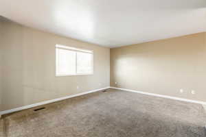 Unfurnished room with baseboards and carpet floors