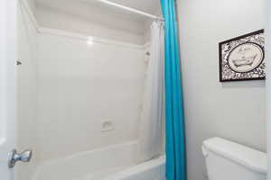 Bathroom with shower / bath combo and toilet