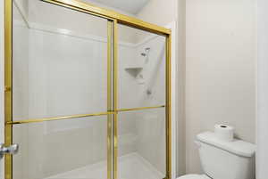 Full bathroom featuring a stall shower