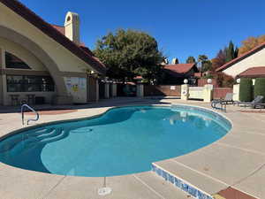 Community pool with a patio area