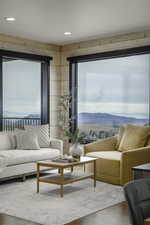 Living room with wood finished floors and a mountain view