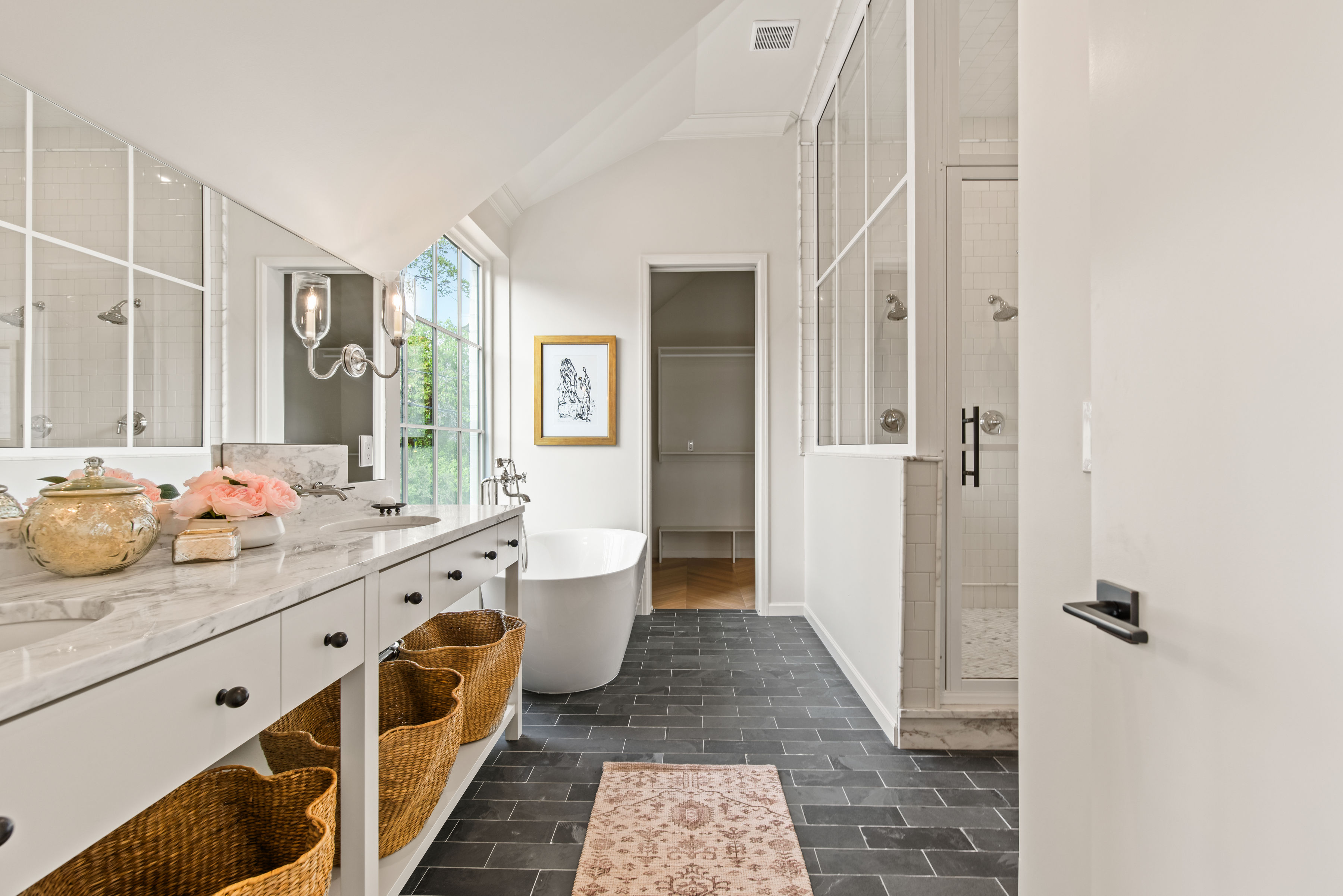 Primary Bathroom with freestanding tub, walk in closet and over-sized shower