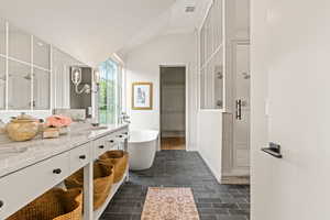 Primary Bathroom with freestanding tub, walk in closet and over-sized shower