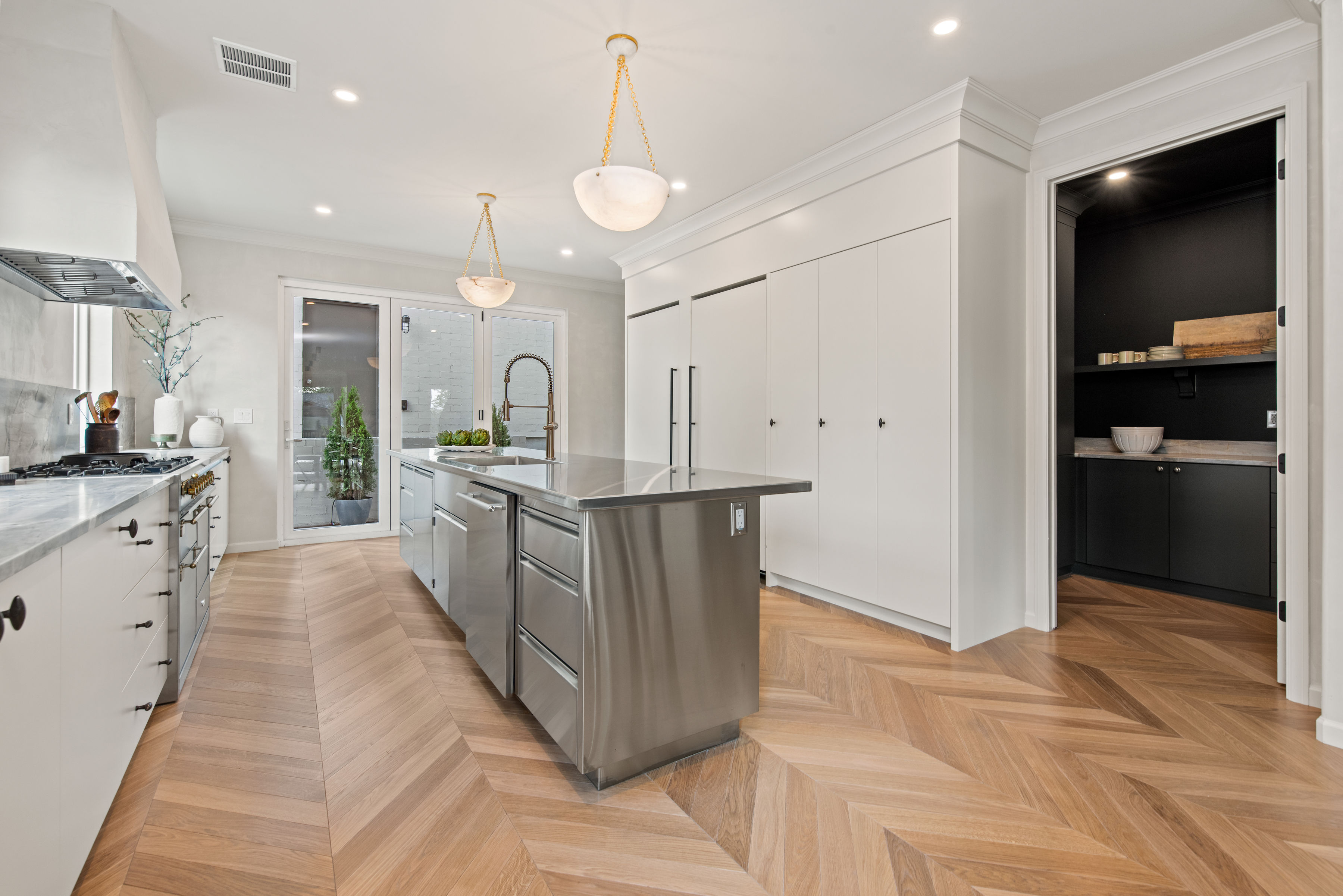 Kitchen with view of butler's pantry