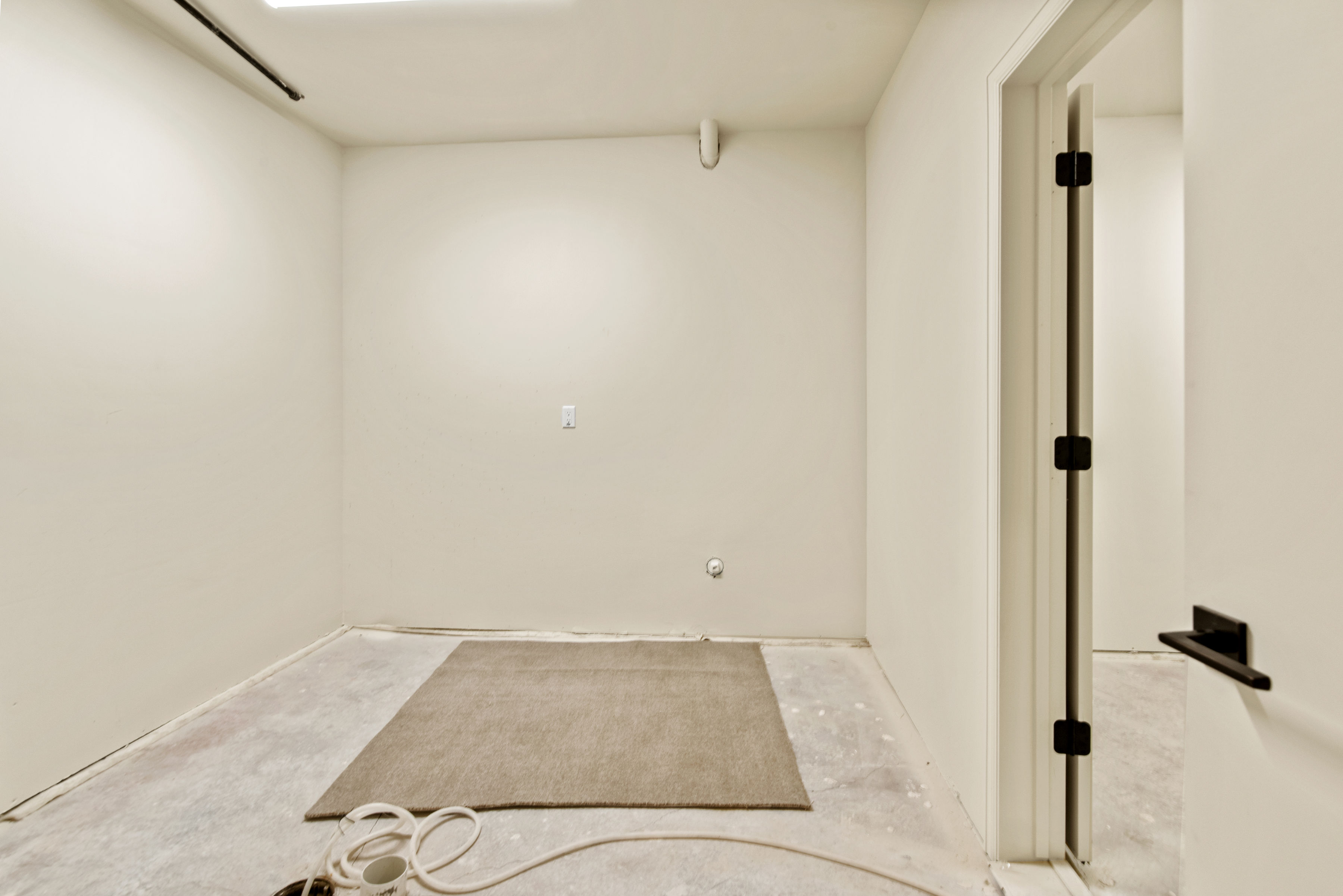 Unfinished utility room with washer and dryer hook ups