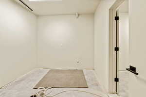 Unfinished utility room with washer and dryer hook ups