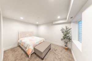 Bedroom featuring light colored carpet and recessed lighting
