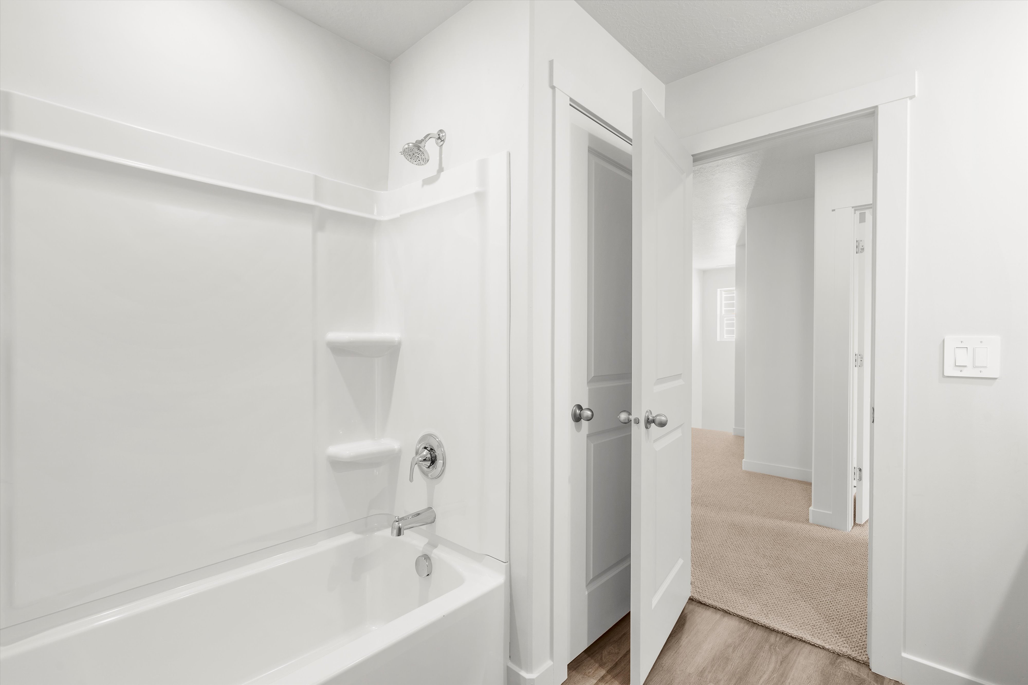 **DISLCAIMER** Exterior & Interior packages may vary.Full bathroom with shower / washtub combination and light wood finished floors