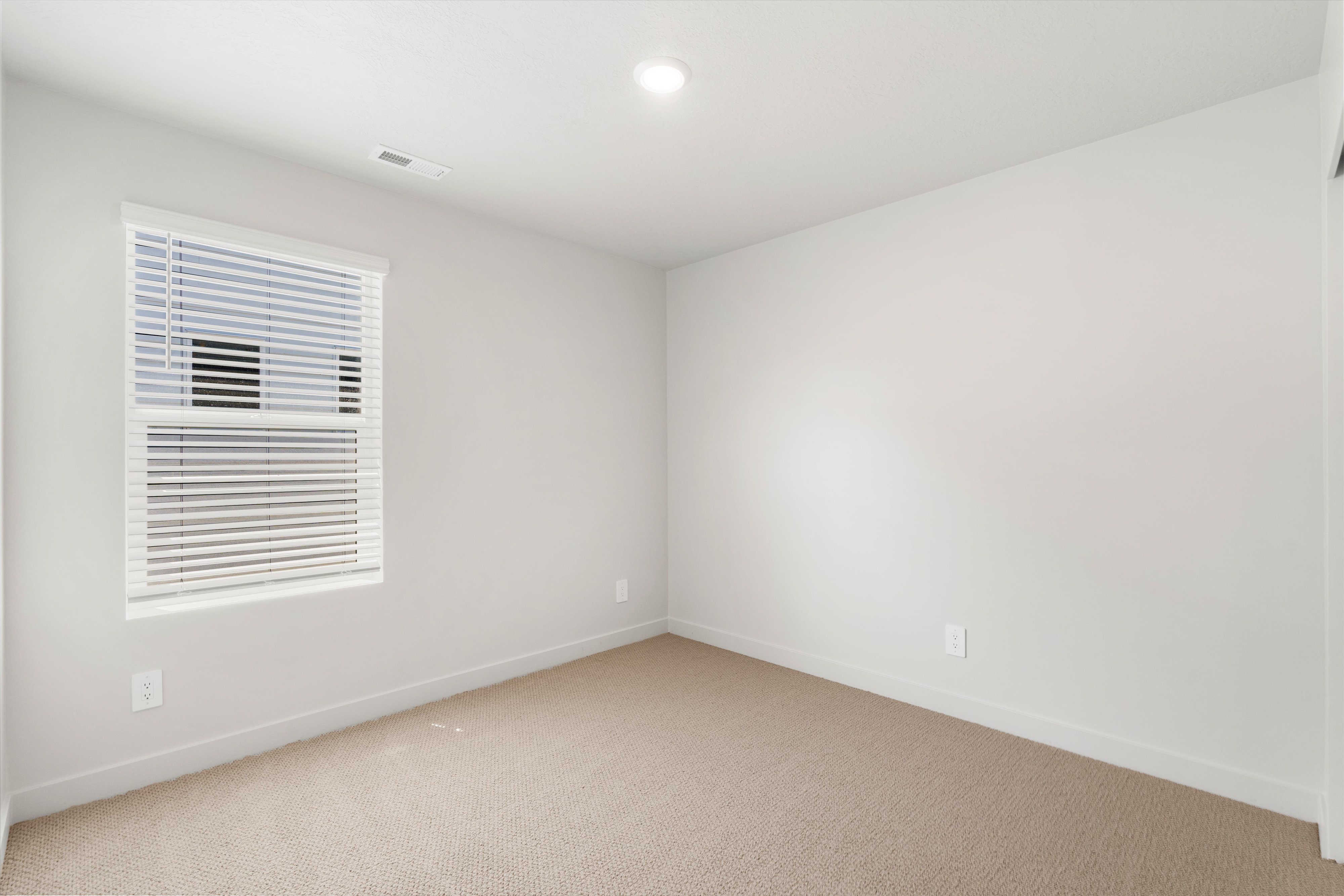 **DISLCAIMER** Exterior & Interior packages may vary.Spare room featuring baseboards and carpet flooring