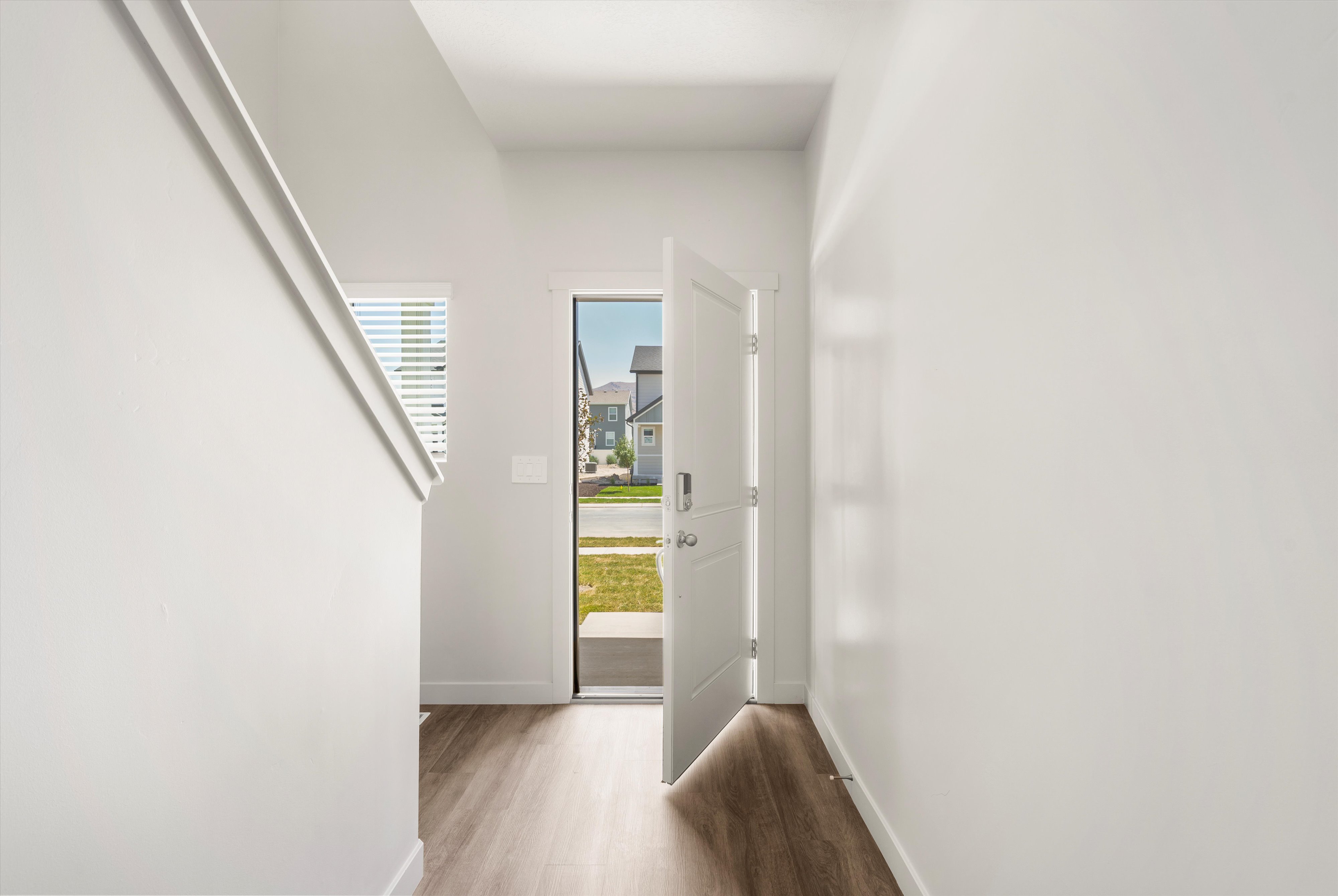 **DISLCAIMER** Exterior & Interior packages may vary.Foyer entrance with wood finished floors and baseboards