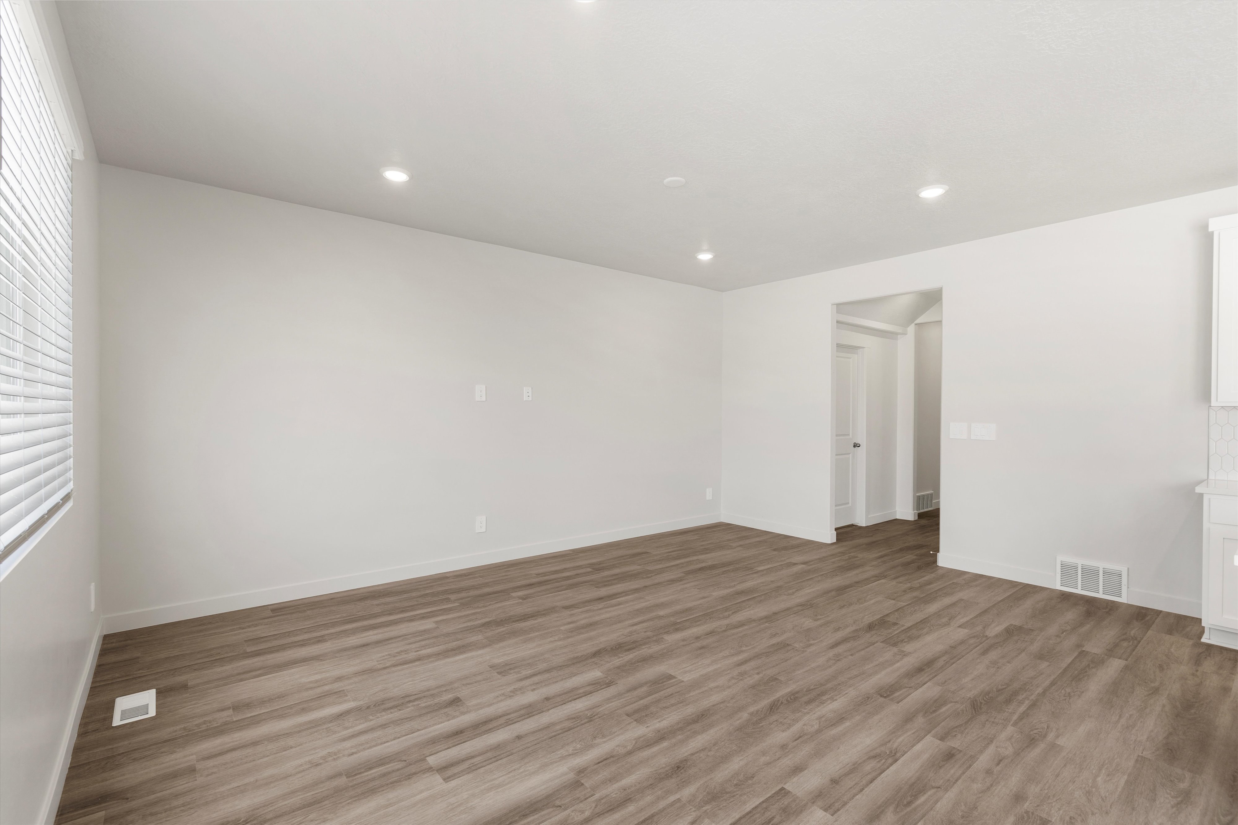 **DISLCAIMER** Exterior & Interior packages may vary.Unfurnished room featuring light wood finished floors and recessed lighting