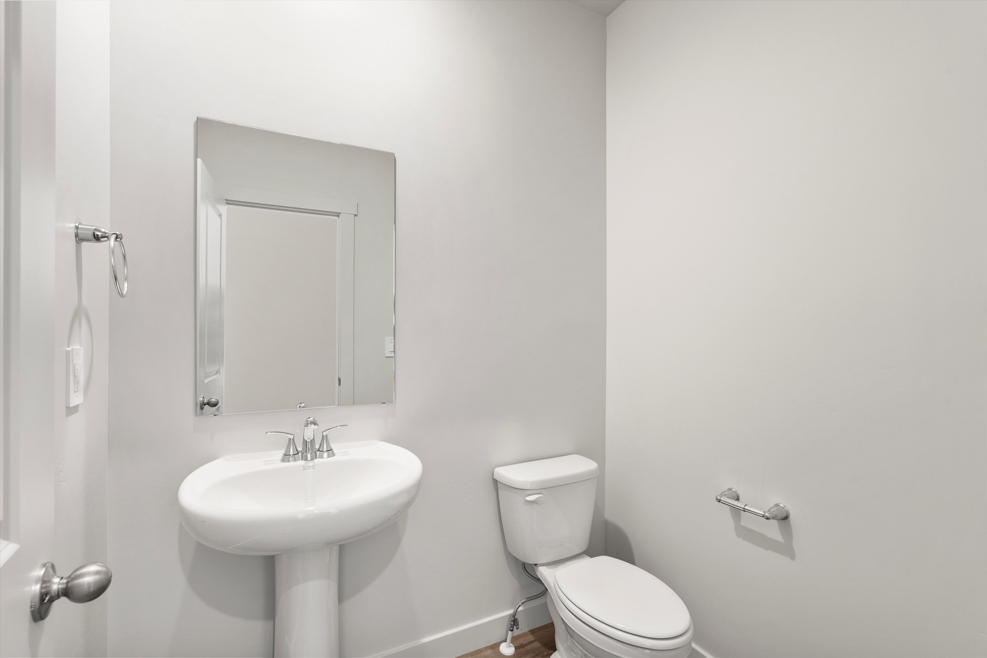Bathroom featuring toilet and baseboards