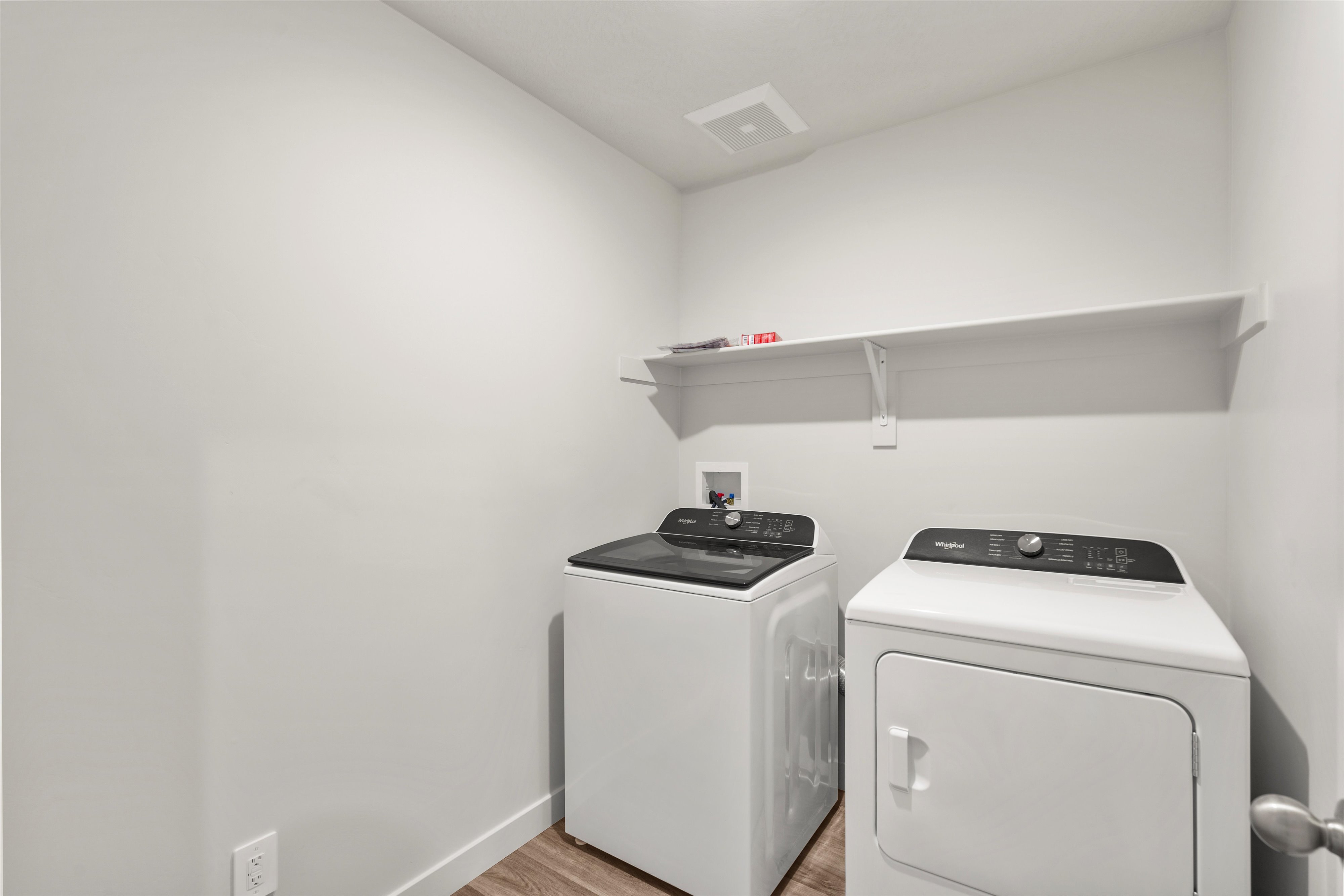 **DISLCAIMER** Exterior & Interior packages may vary.Washroom with light wood-style floors and washer and dryer