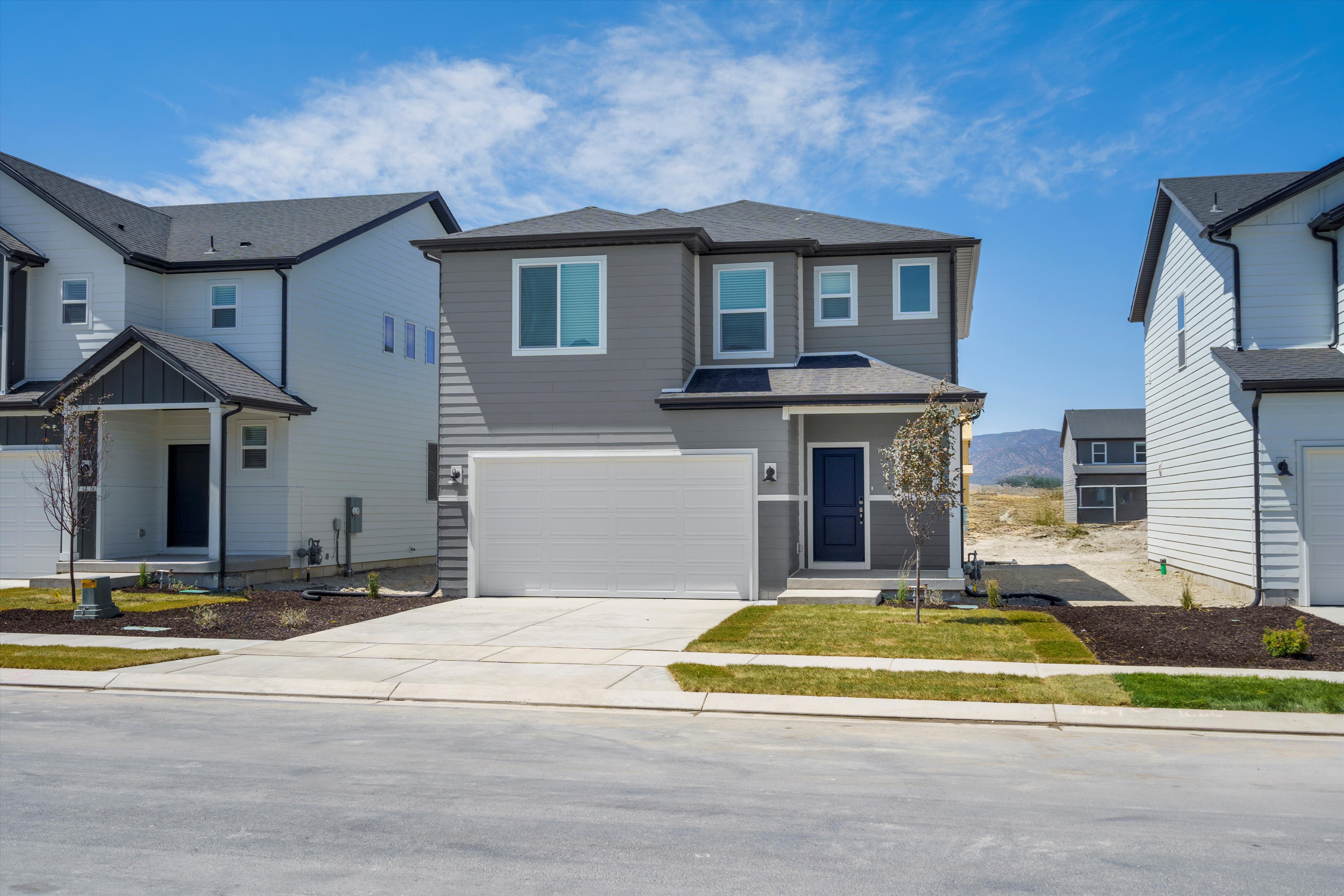 **DISLCAIMER** Exterior & Interior packages may vary.View of front of house featuring driveway, a garage, and a residential view