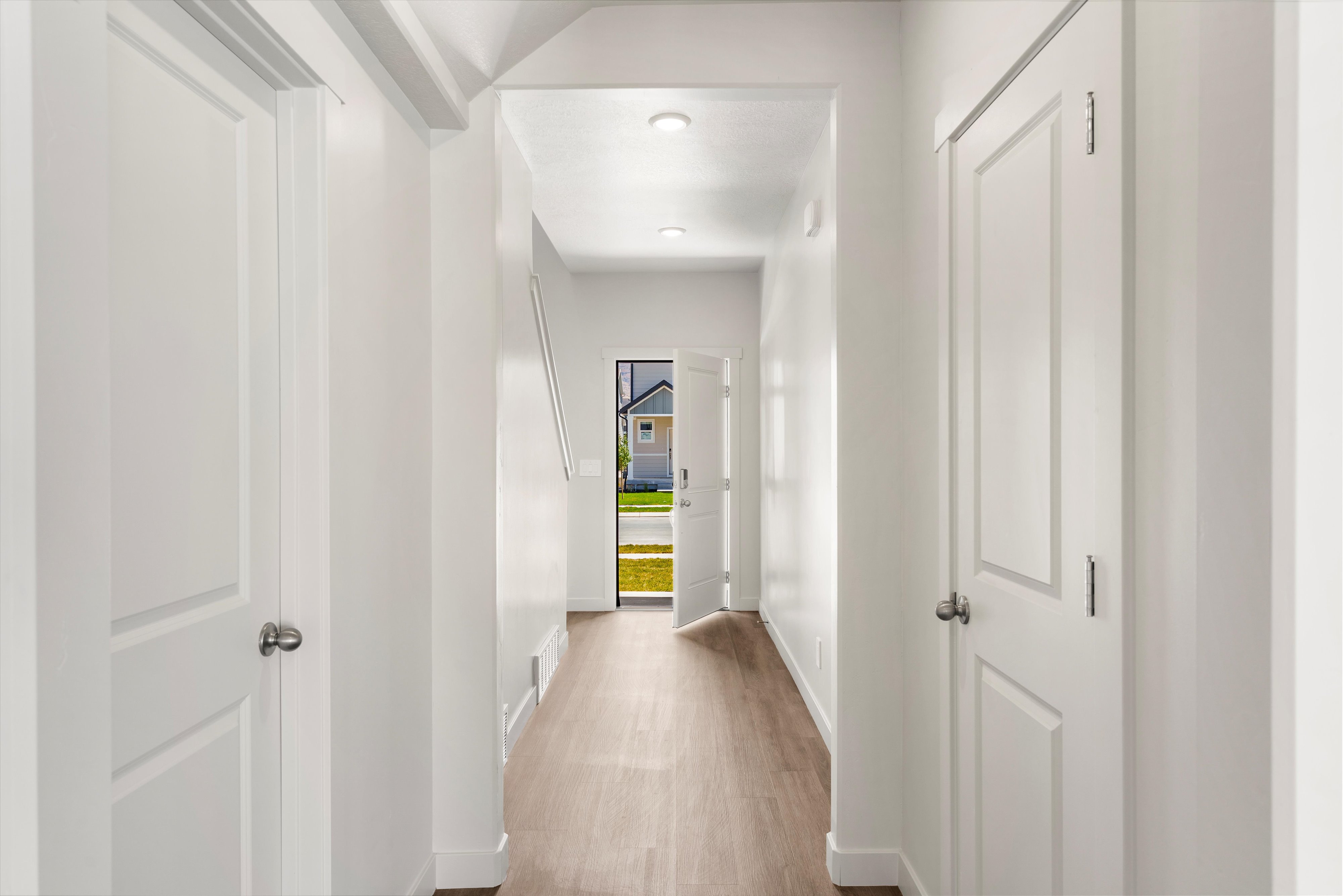**DISLCAIMER** Exterior & Interior packages may vary.Hallway featuring baseboards and light wood-style flooring