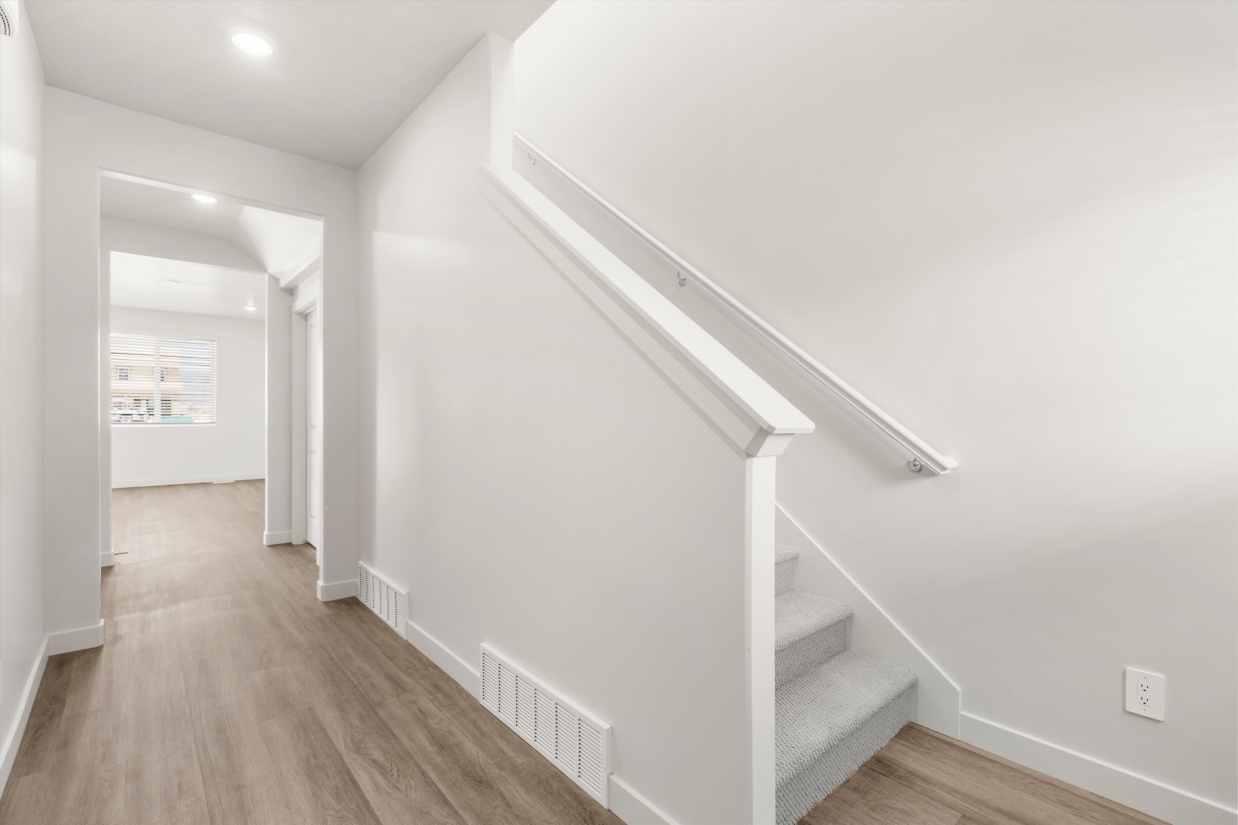 **DISLCAIMER** Exterior & Interior packages may vary.Stairway featuring wood finished floors and recessed lighting