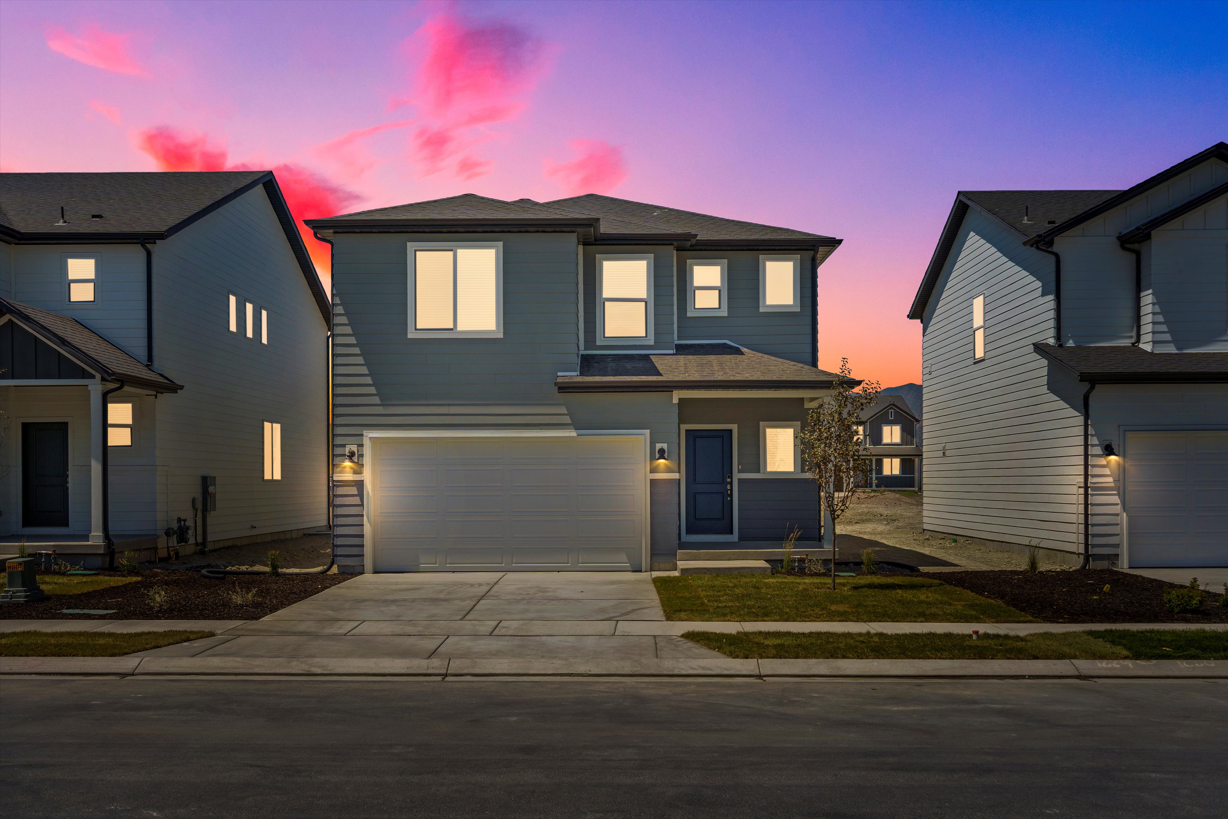 **DISLCAIMER** Exterior & Interior packages may vary.View of front of home with concrete driveway, a garage, and a shingled roof