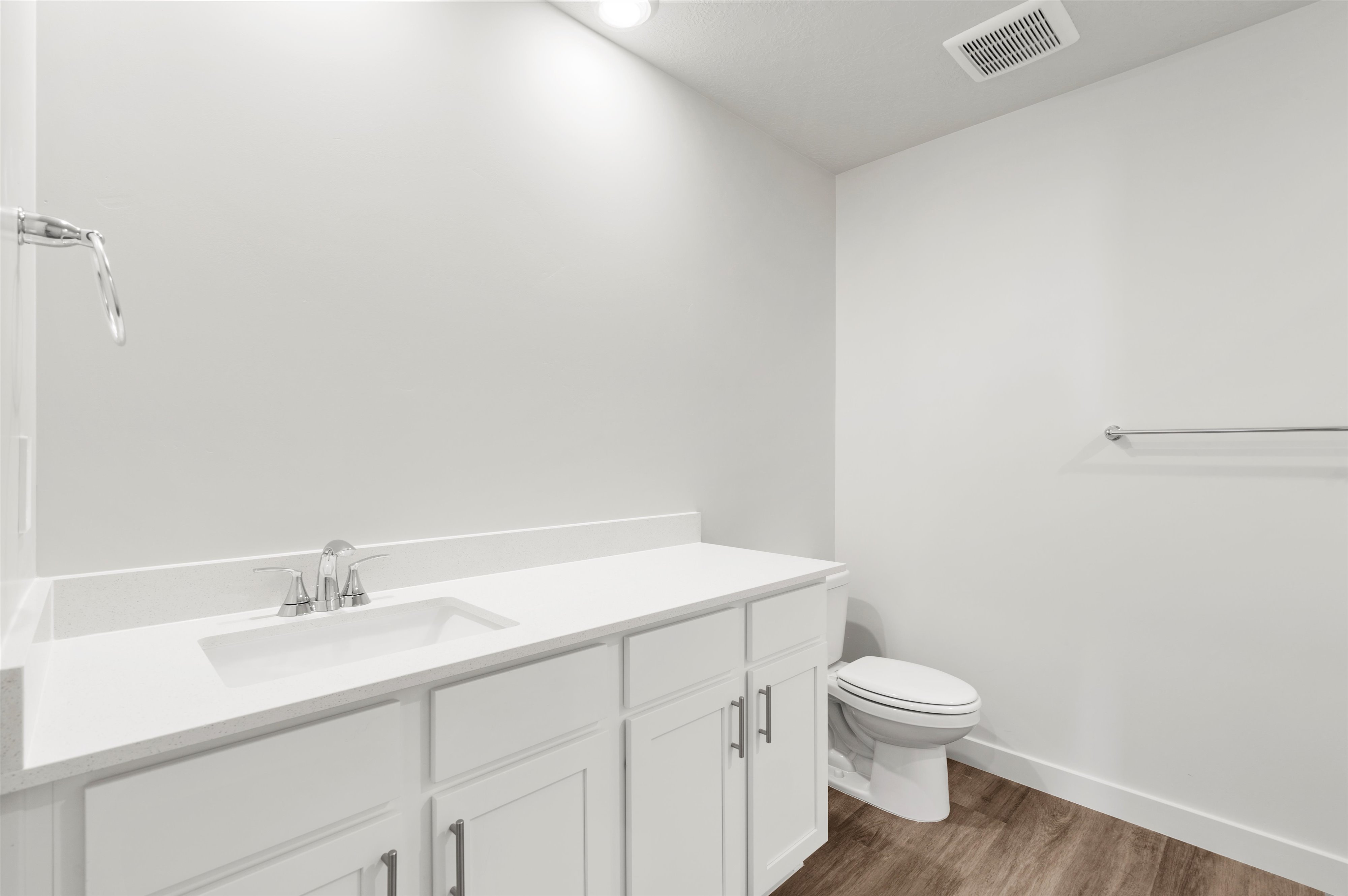 **DISLCAIMER** Exterior & Interior packages may vary.Half bath with vanity and dark wood finished floors