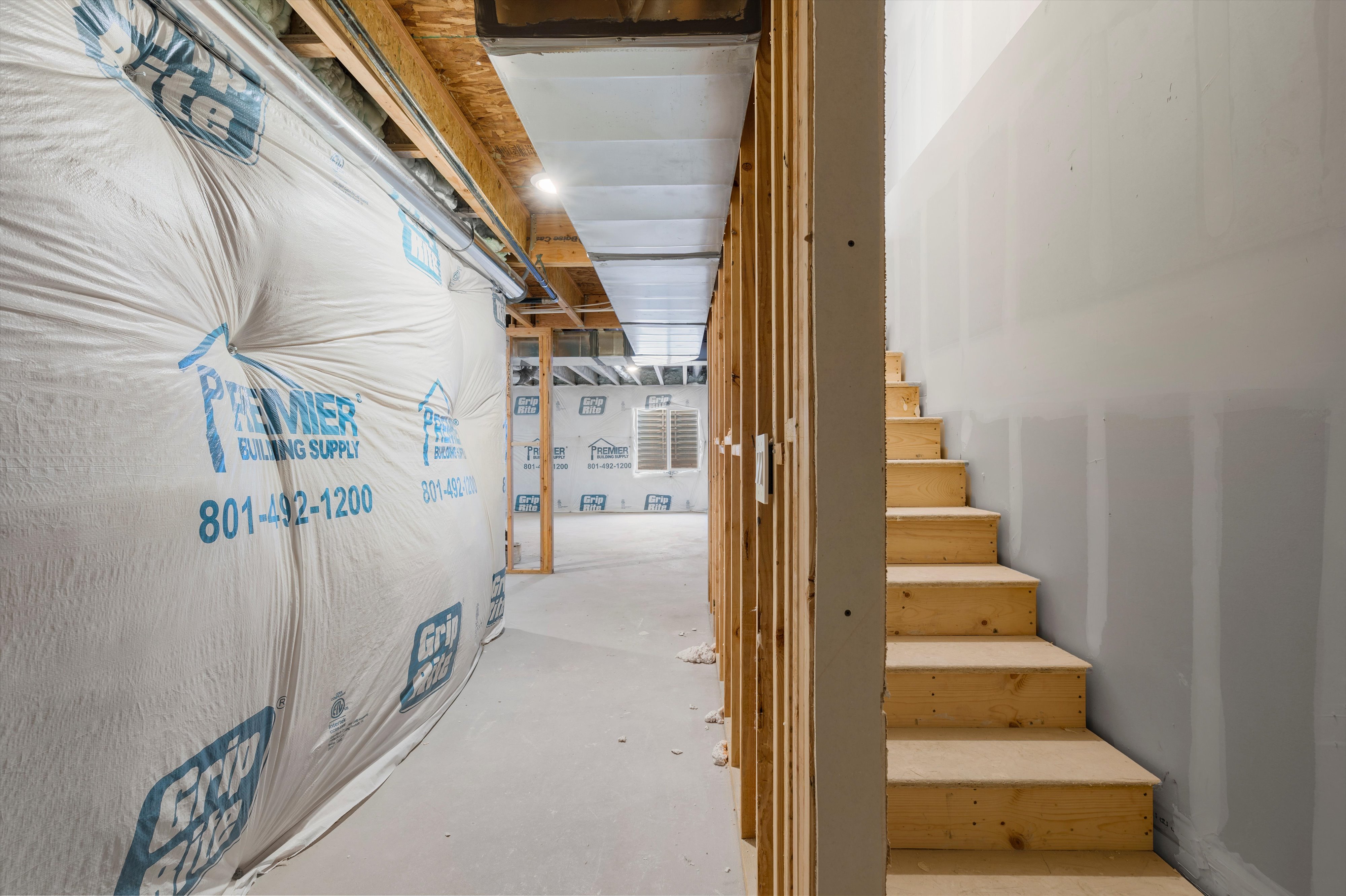 Unfinished basement with stairway