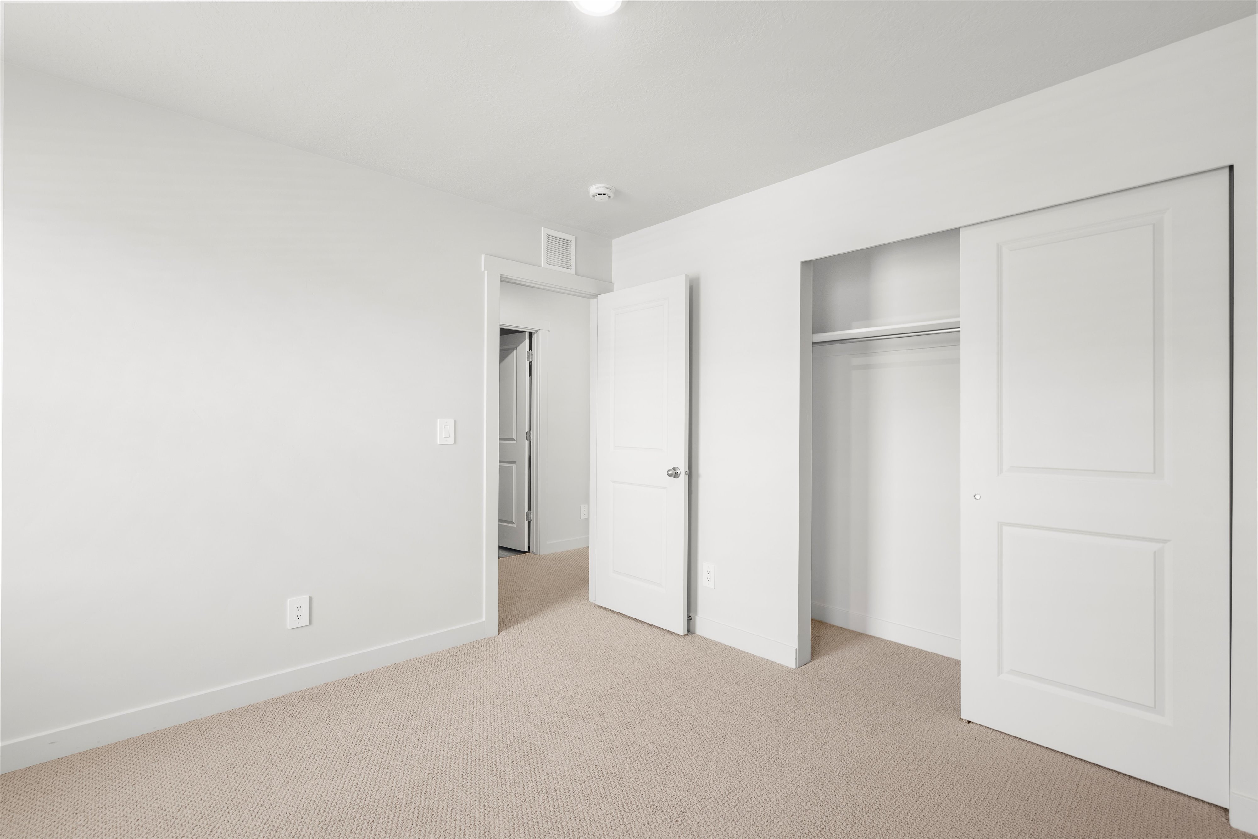 **DISLCAIMER** Exterior & Interior packages may vary.Unfurnished bedroom with carpet flooring and a closet