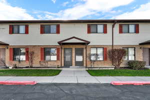 View of front of home featuring brick siding