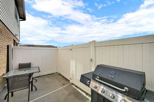 View of patio. Grill, patio furniture are included