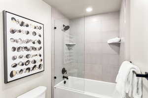 Full bathroom featuring shower / bathtub combination and recessed lighting