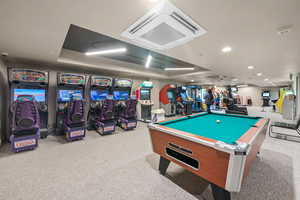 Recreation room with cooling unit, recessed lighting, and billiards table