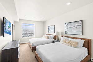Carpeted bedroom featuring baseboards and recessed lighting